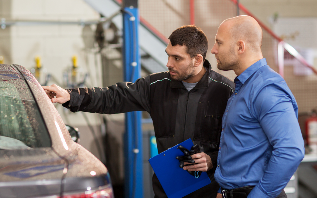 Automotive service manager showing a customer the work that was done on their vehicle. Customer service is an essential skill for any automotive service manager resume.